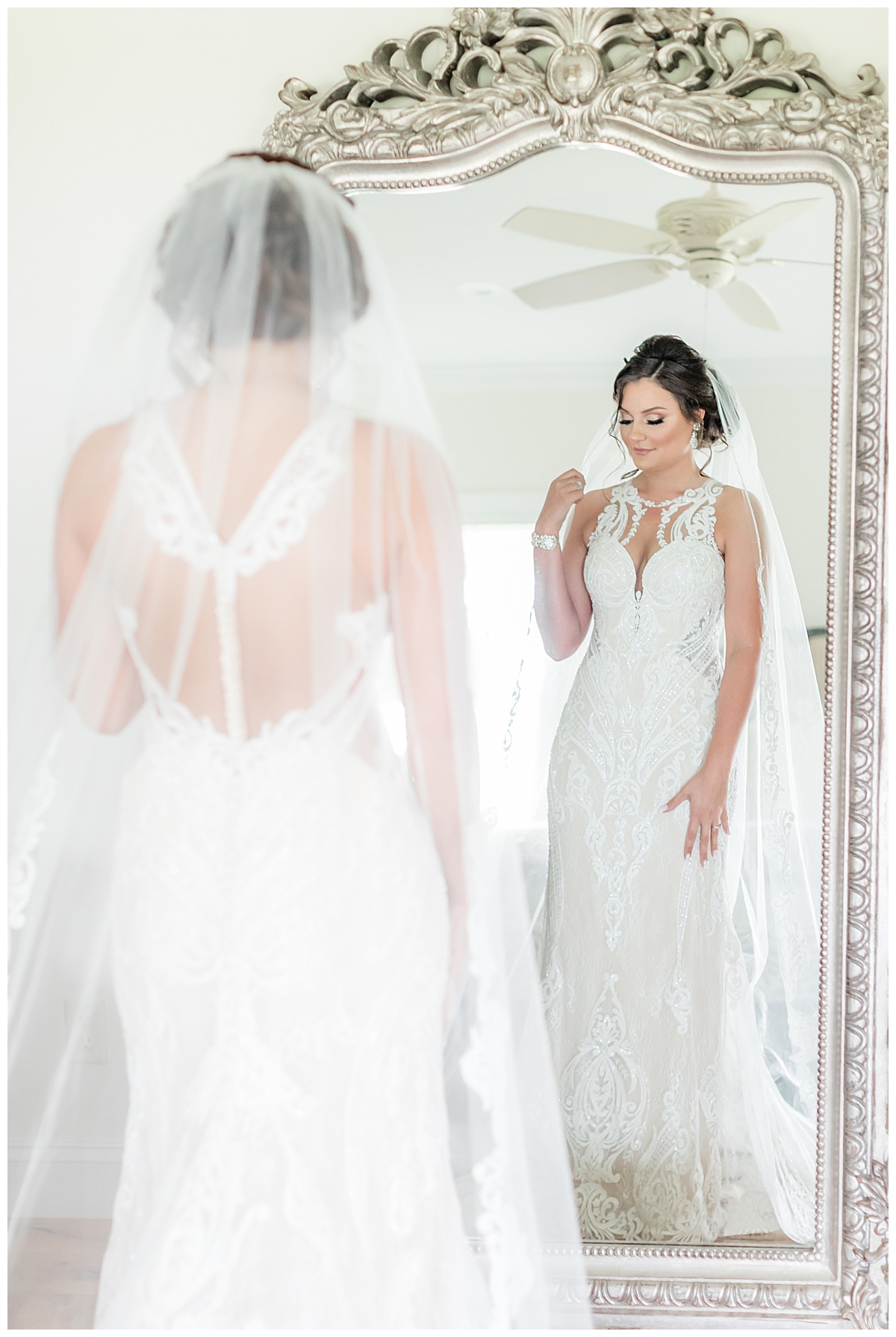 Martina Liana wedding dress bride looking in mirror