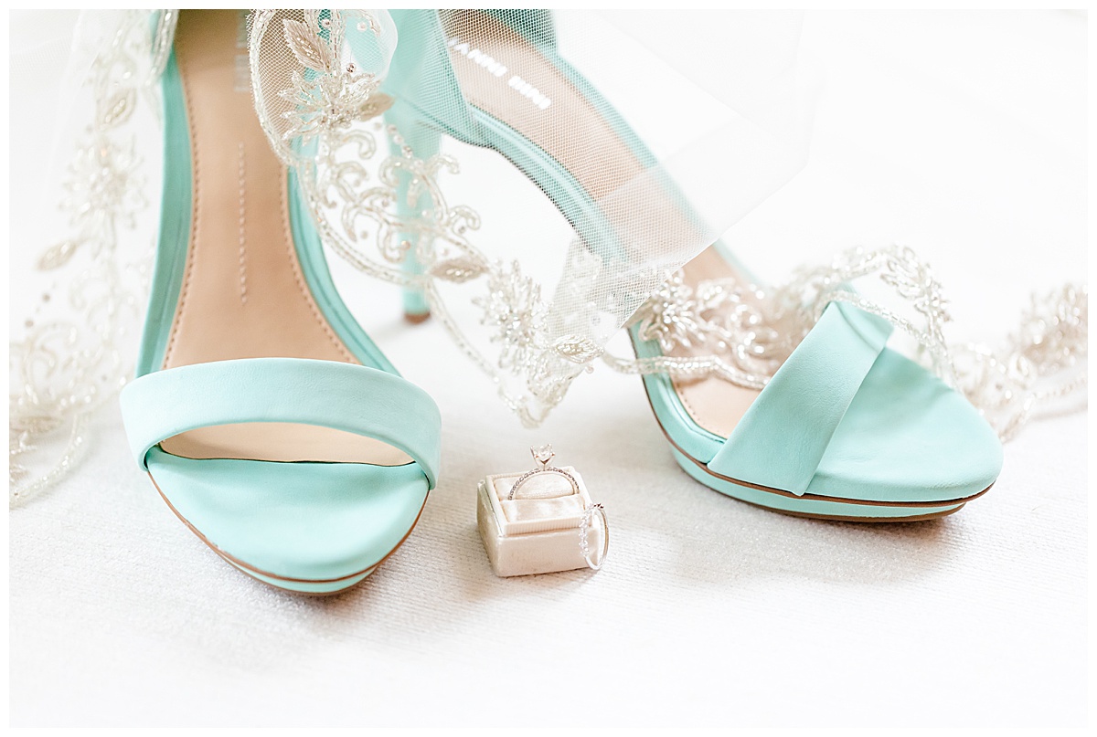 blue wedding shoes with ring and veil