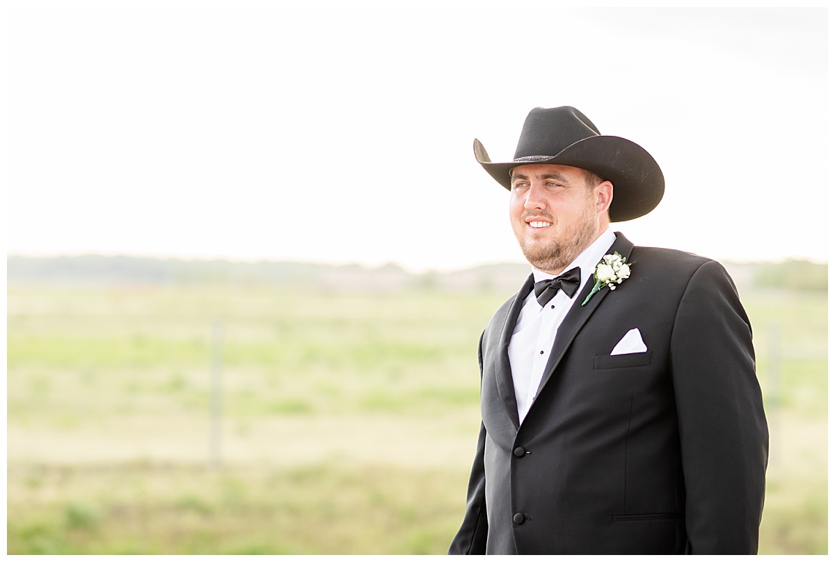 groom wearing cowboy hat