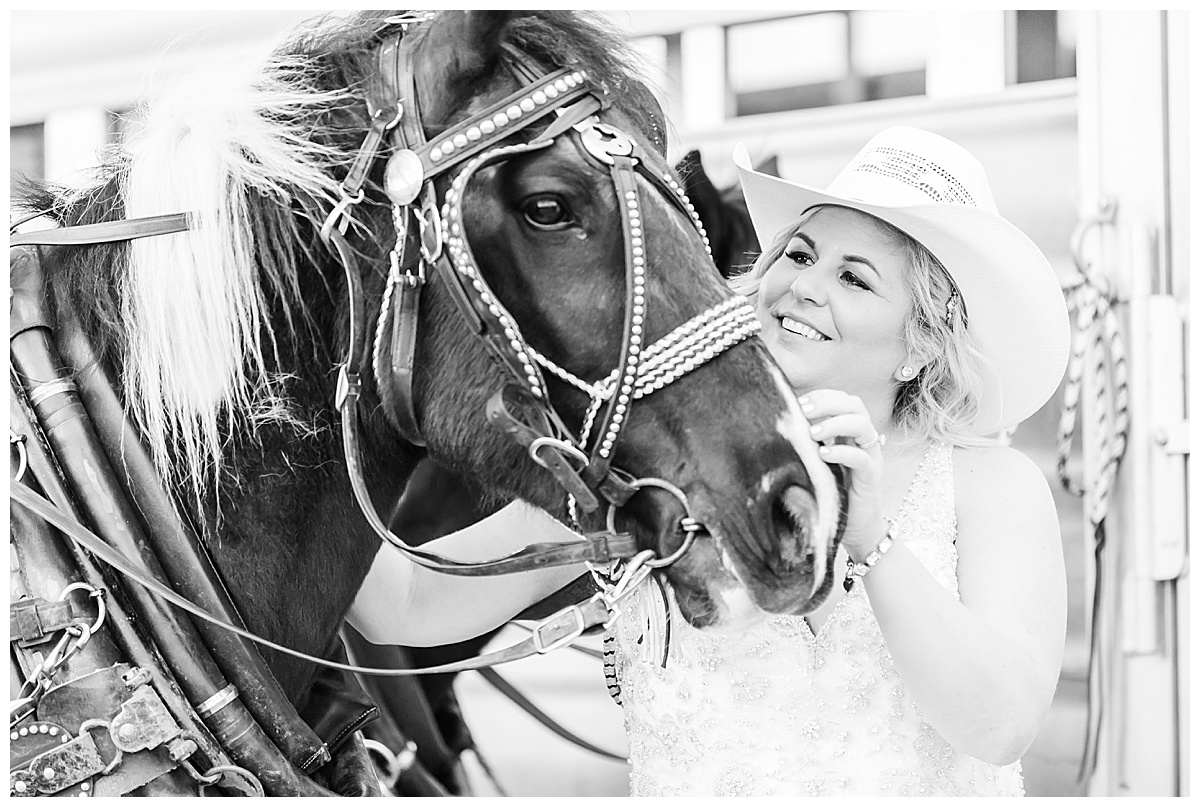bride in cowboy hat with horse