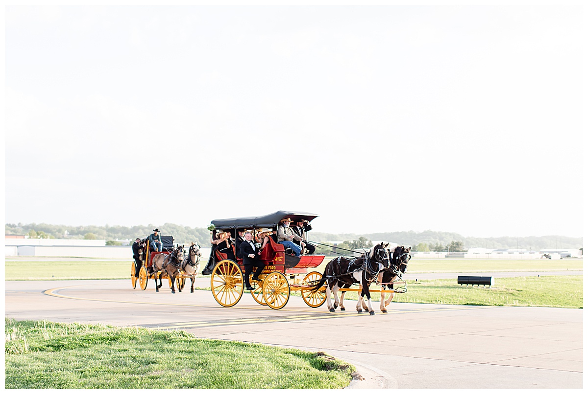 horse drawn stagecoach with bridal party