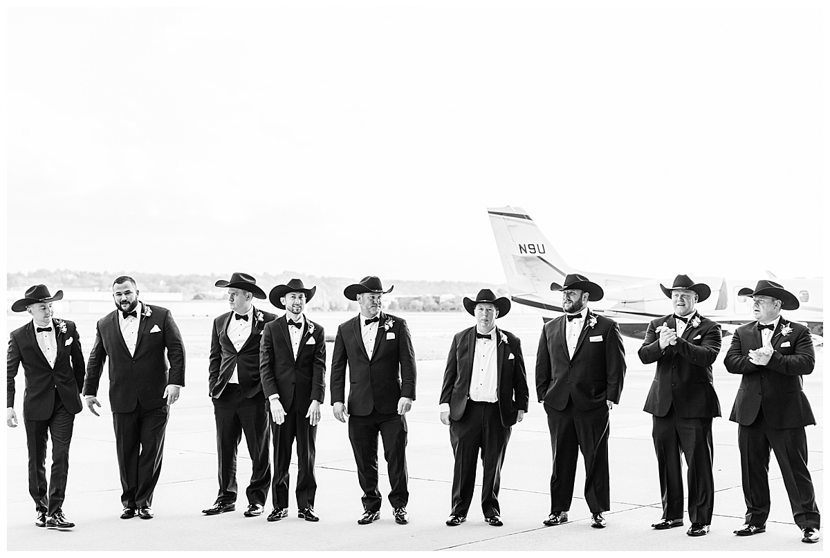 groomsmen wearing cowboy hats