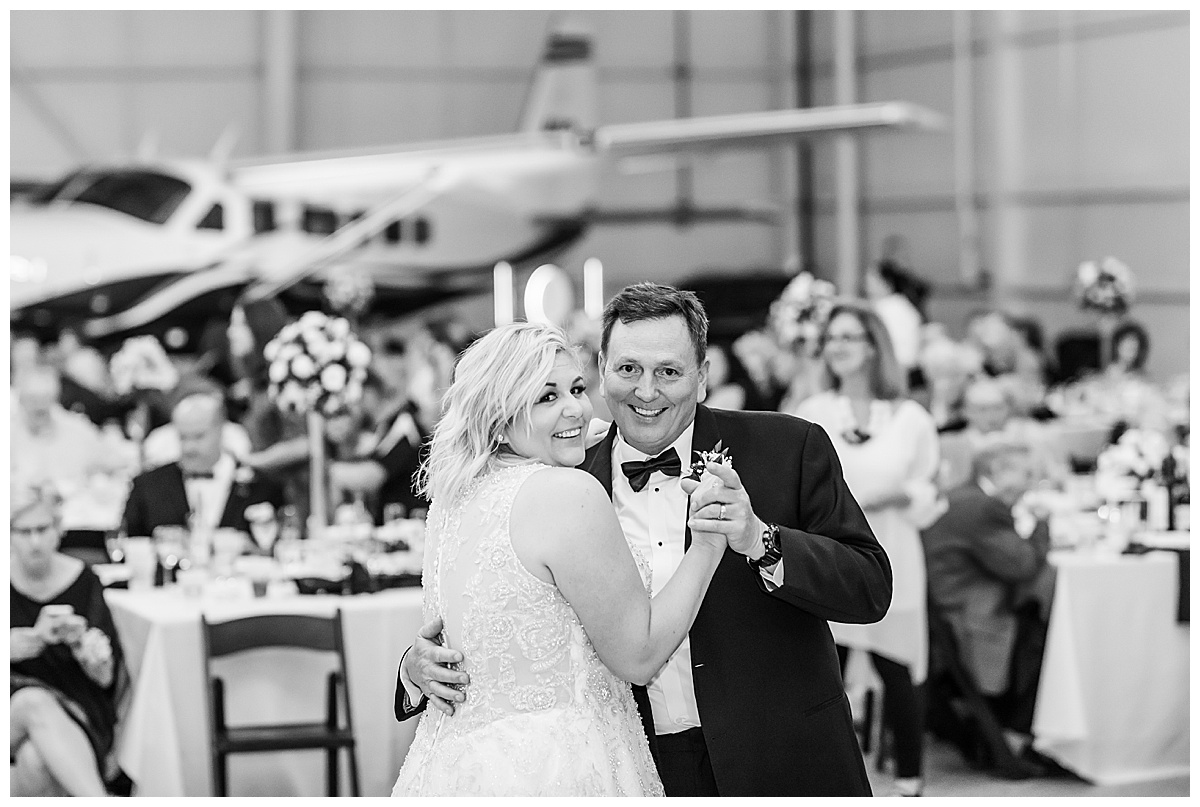 father daughter dance in airplane hangar
