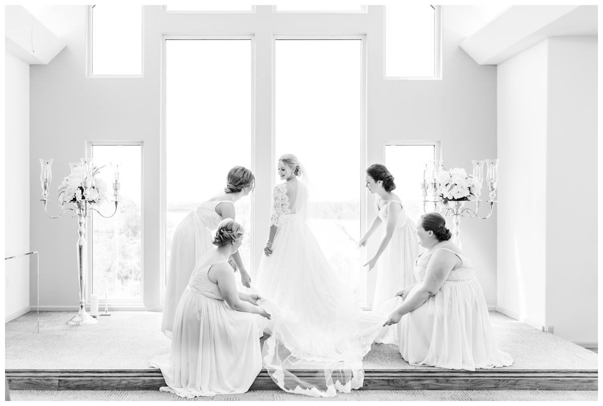 bridesmaids fluffing Maggie Sottero wedding dress