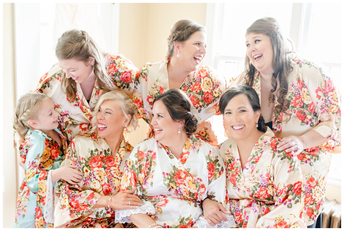bridesmaids wearing floral robes at Cedar Creek
