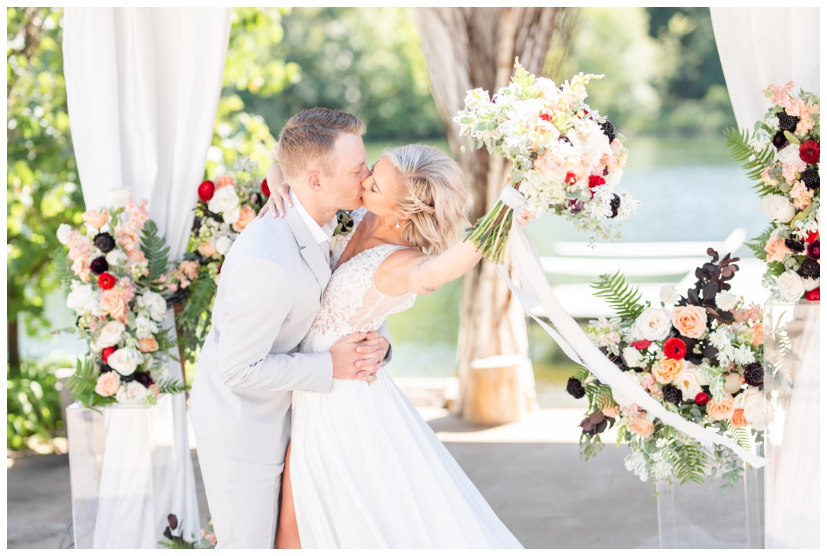 bride and groom kissing at Little Piney Lodge
