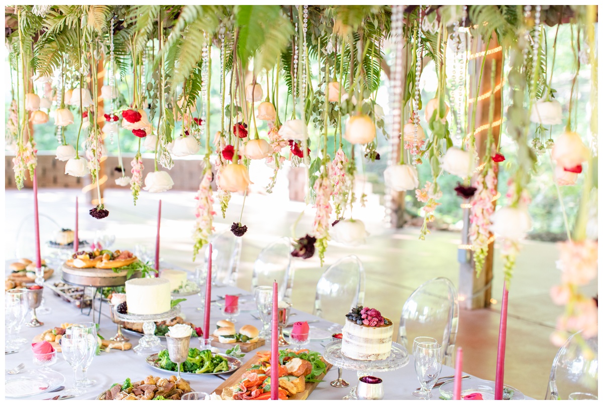hanging flowers over reception table