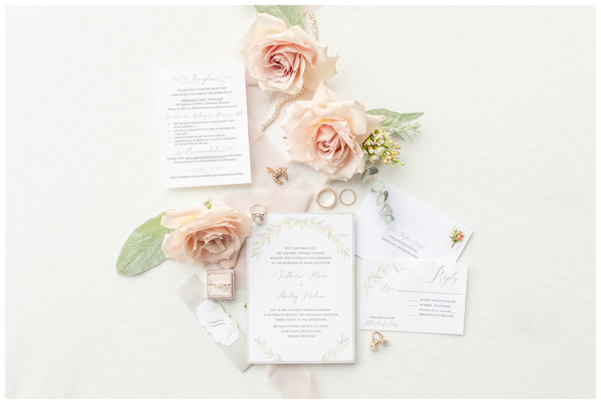blush and peach wedding invitation suite with flowers