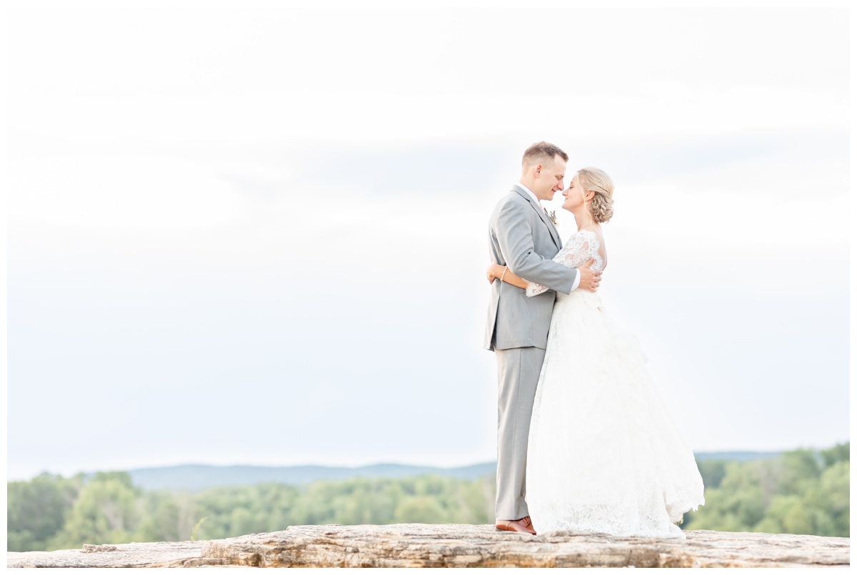 Bride and groom on bluffs at Hermann Hill