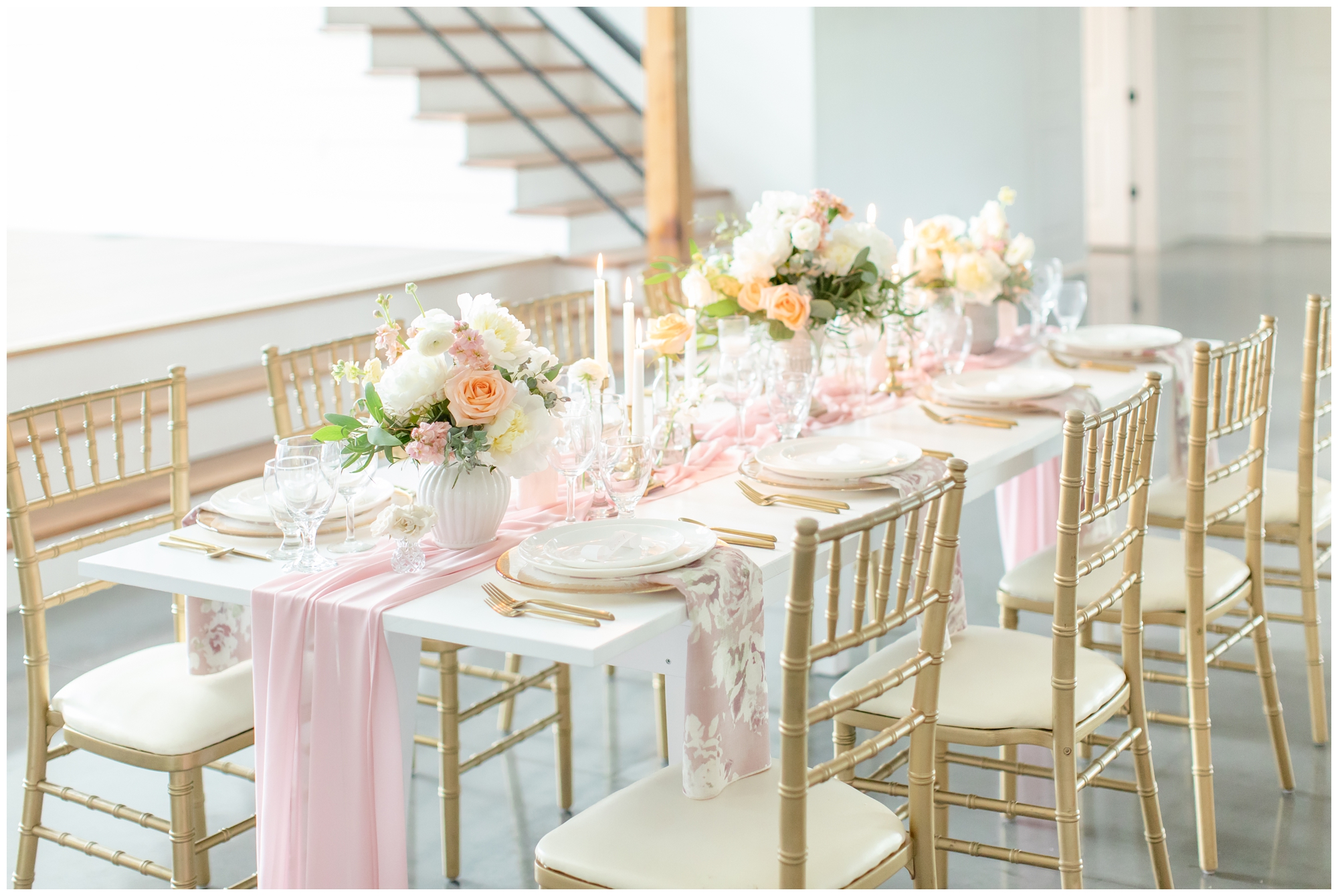 white farmhouse tables at Emerson Fields wedding venue