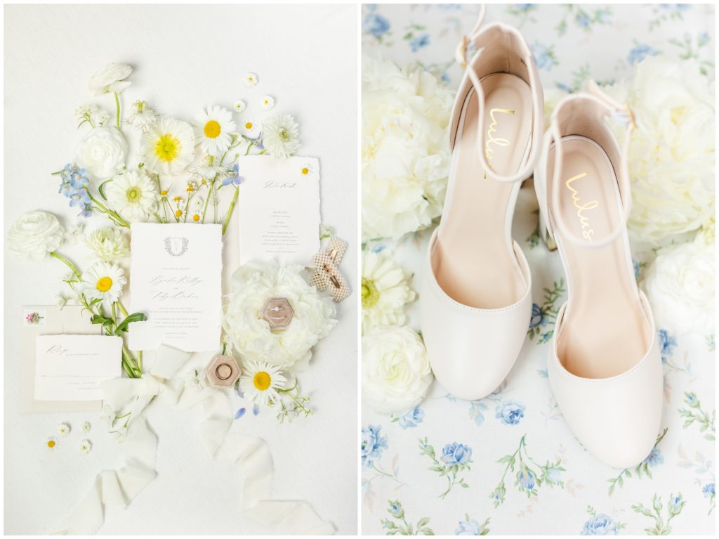 A soft and romantic invitation suite is pictured. It has white and light blue forals in the background. The picture on the right is white round-toe wedding pumps on top of a light blue floral fabric piece. 