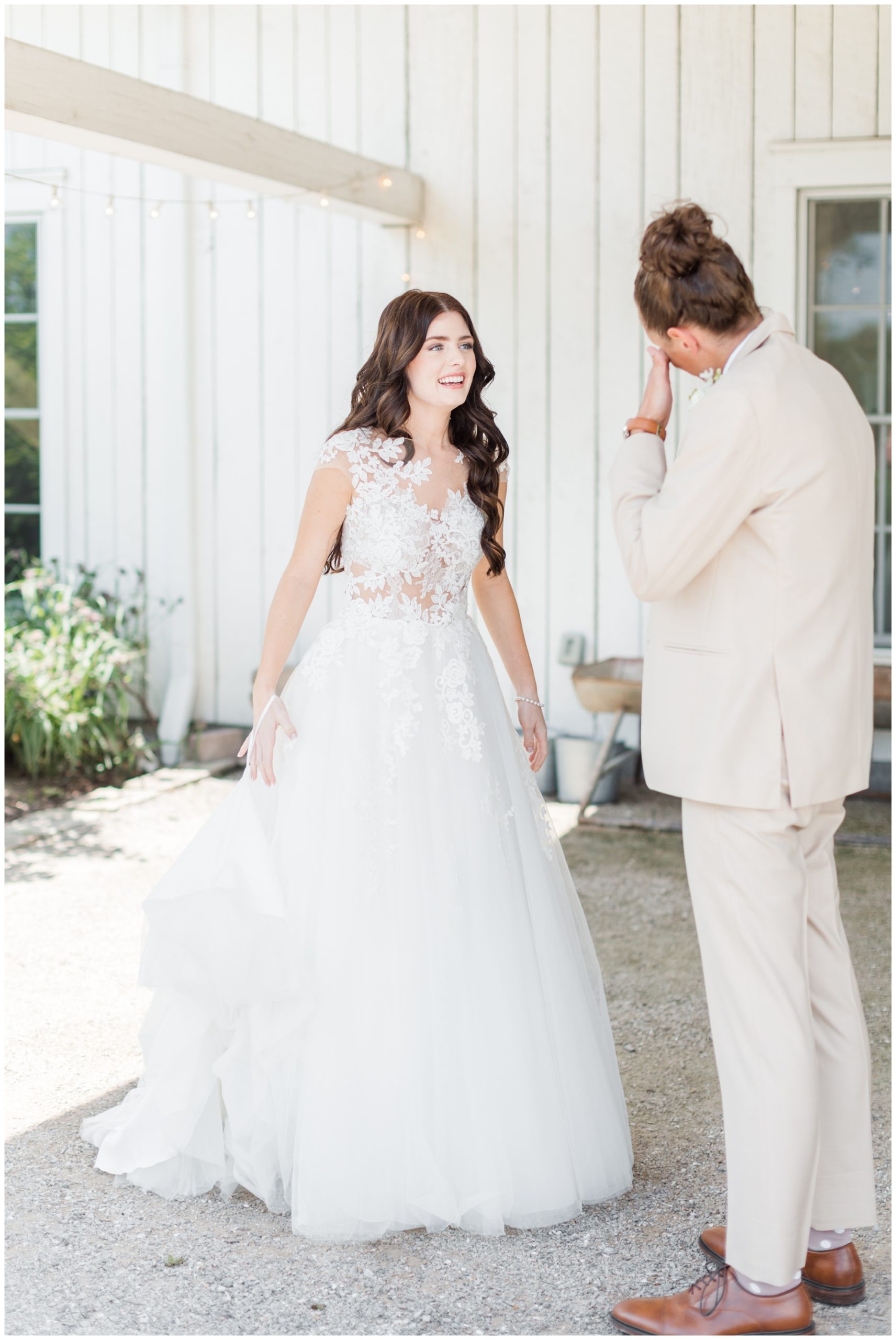 The bride and groom have their first look at their Blue Bell Farm wedding. 