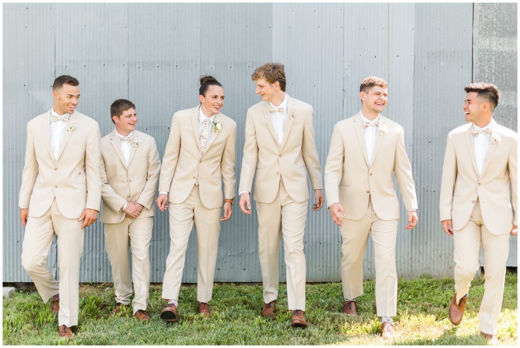 The groom poses with his groomsmen.