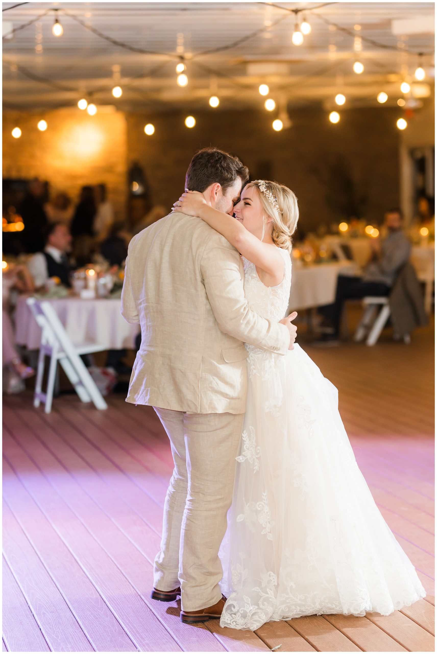 The bride and groom enjoy their first dance at the wedding reception at deception vineyard. 