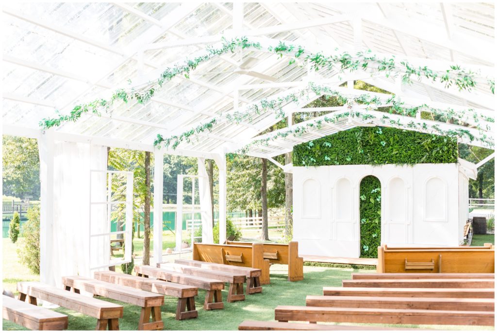 An outdoor wedding tent is set up at Loveland Estates 