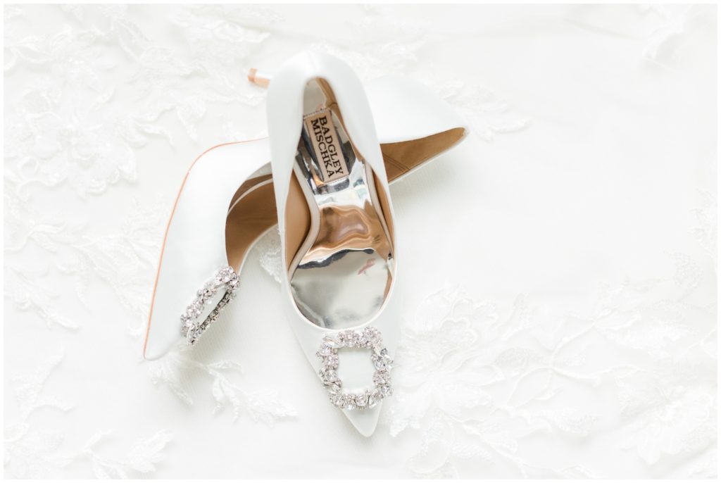 The bride's white Badgley Mischka wedding shoes.