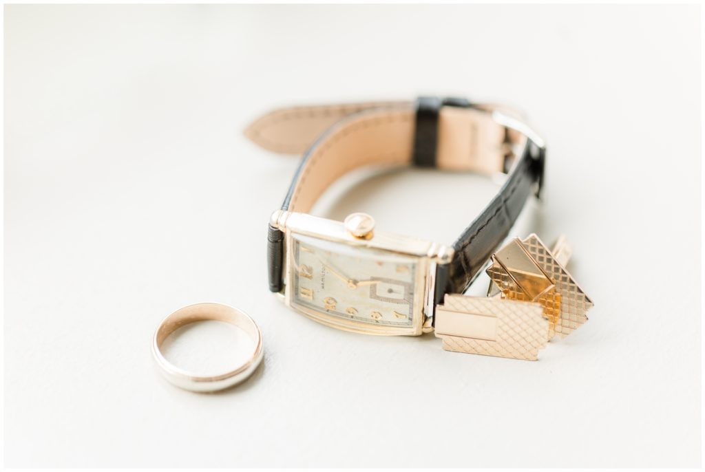 The groom's watch, ring, and cuff links are pictured. 