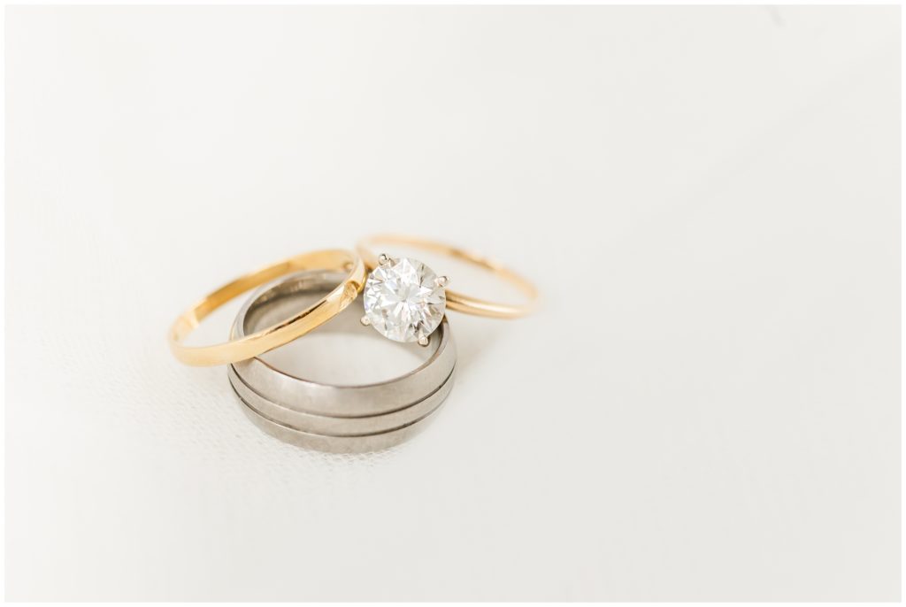 picture shows the engagement ring and both wedding bands. 