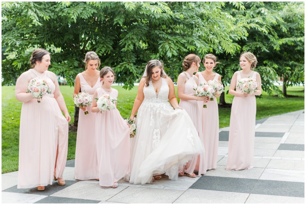 The bride and her bridesmaids take a candid shot. 