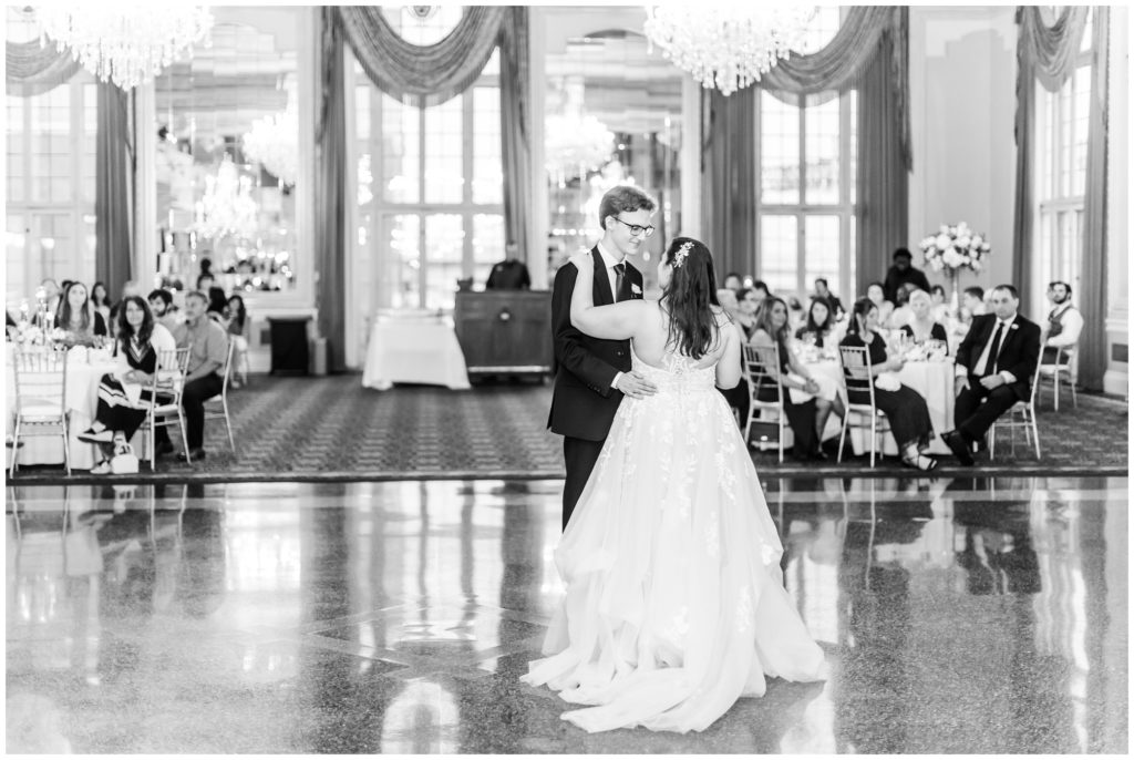 The couple enjoys their first dance in the ballroom of the Missouri Athletic club 