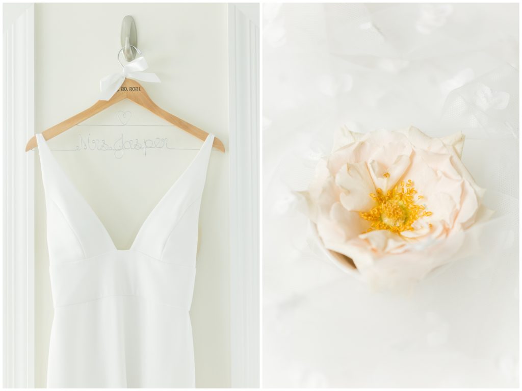 1st pic: The bride's wedding dress is hung on a custom wedding hanger. 2nd pic: a light peach flower is displayed on a wedding veil. 