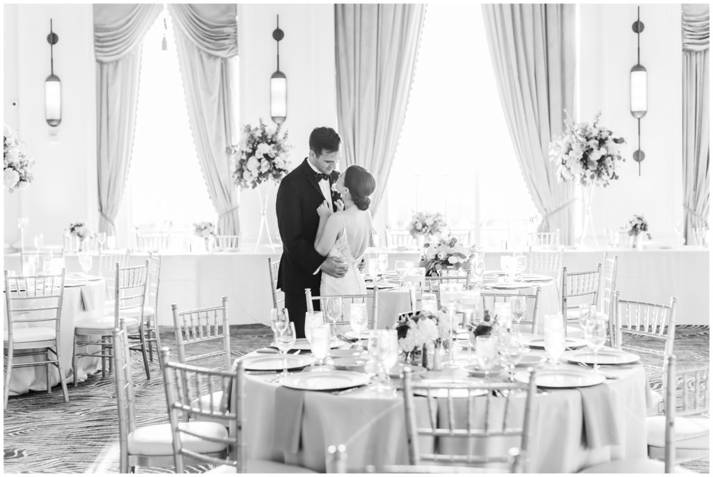 The bride and groom share a private moment at their  wedding reception at the st louis grand hotel. 