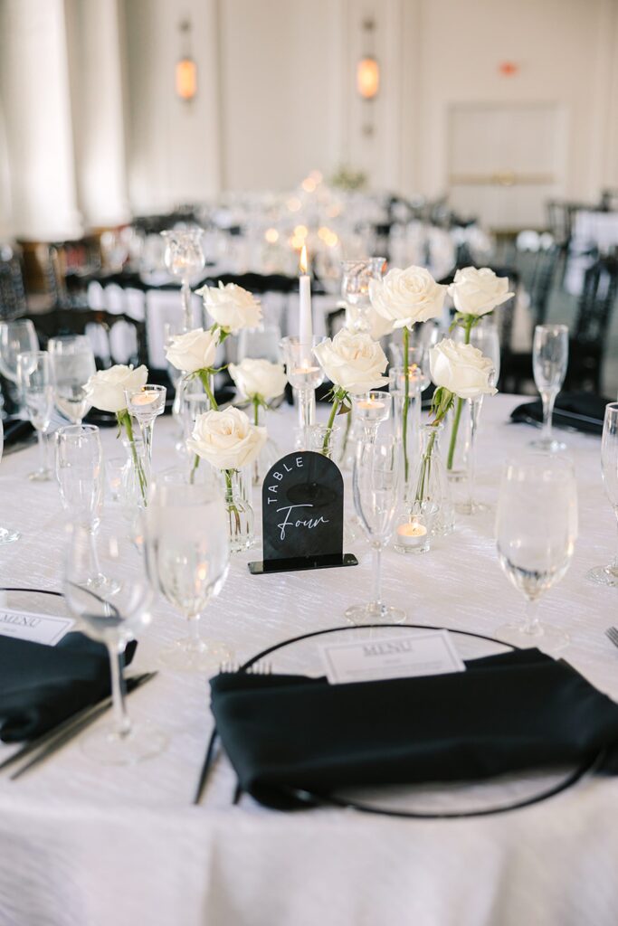 White rose, black accents table decor, black and white wedding design