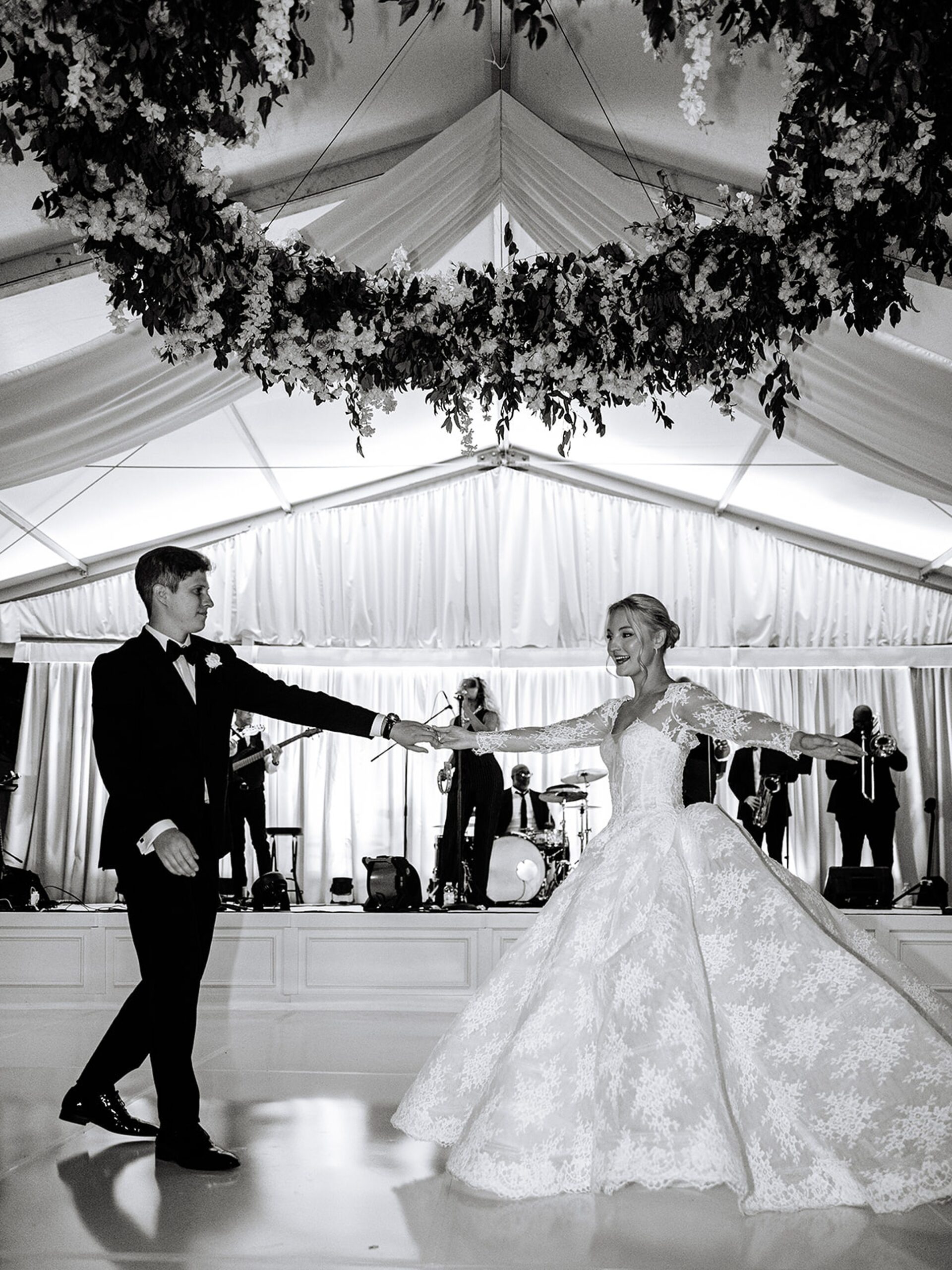bride-and-groom-share-first-dance-under-tent